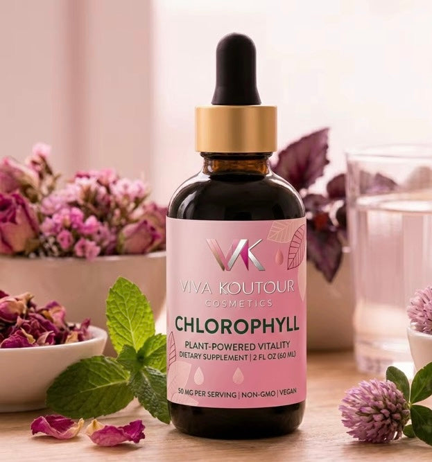 Viva Koutour Chlorophyll supplement bottle on a table with flowers and plants in the background