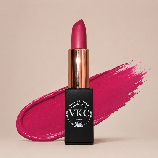 Pink lipstick with black VKC packaging on a beige background