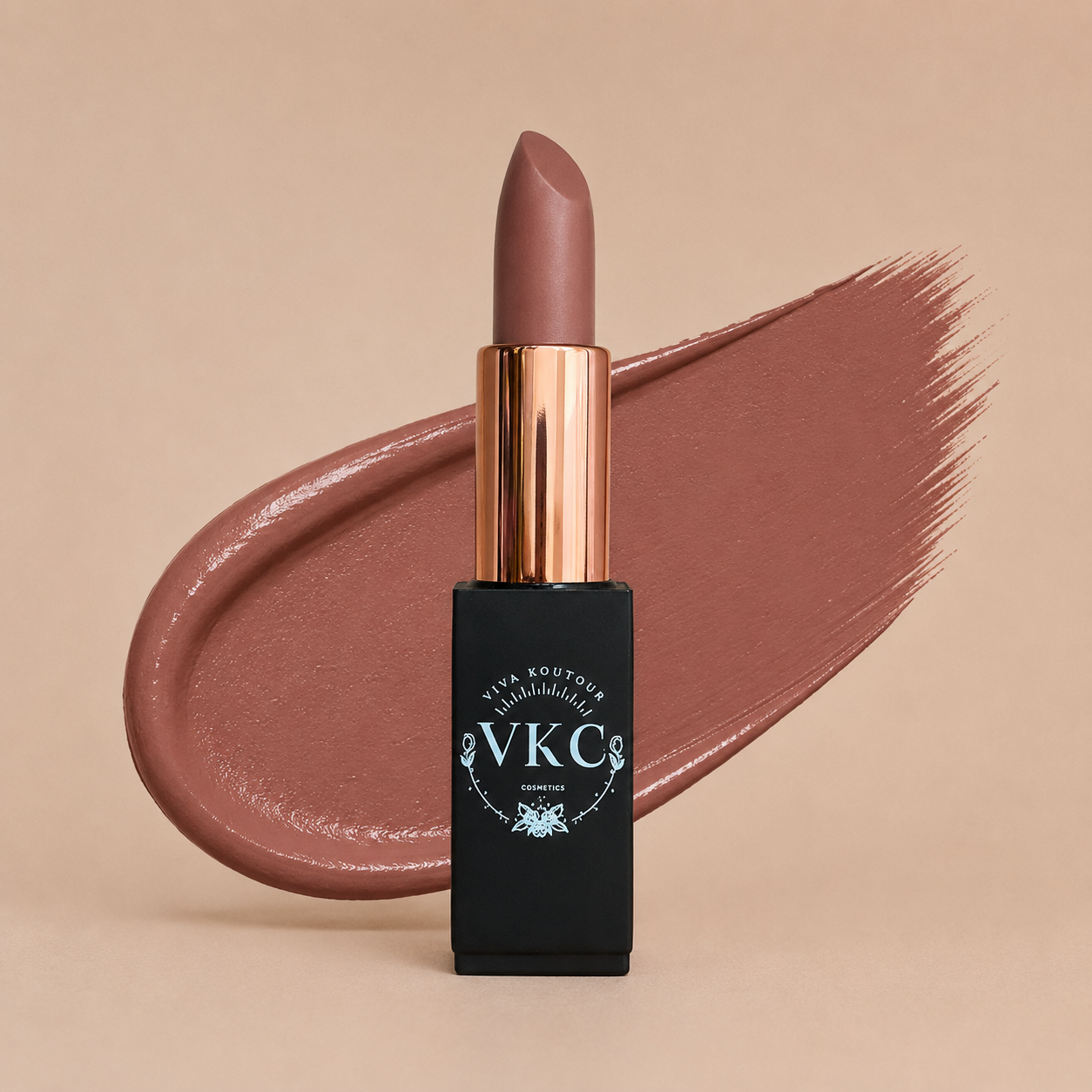 Lipstick with bronze cap and black casing on a beige background