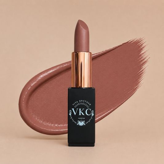 Lipstick with bronze cap and black casing on a beige background