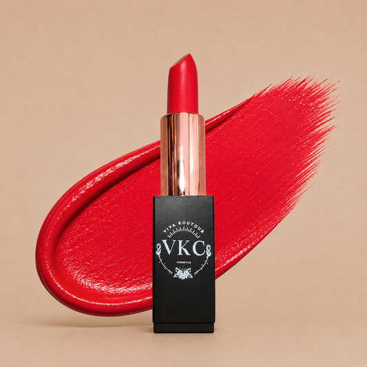 Red lipstick with black VKC packaging on a beige background